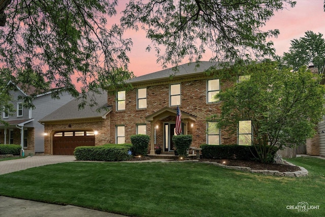 2255 University Dr, Naperville, IL 60565 - view of front of house with brick siding, an attached garage, driveway, and a lawn