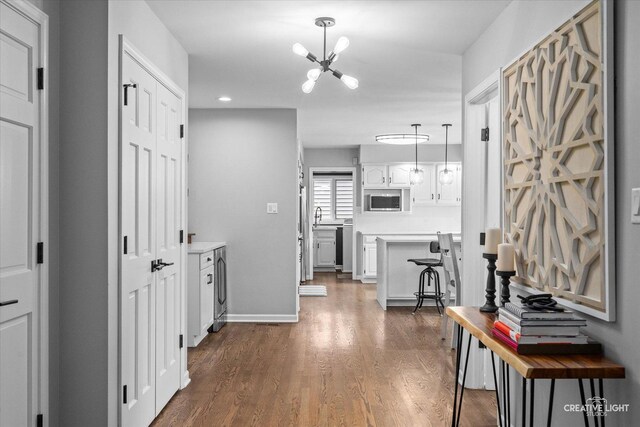 2255 University Dr, Naperville, IL 60565 - hallway featuring a chandelier, dark wood finished floors, recessed lighting, a sink, and baseboards
