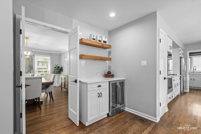 2255 University Dr, Naperville, IL 60565 - indoor dry bar with wine cooler, freestanding refrigerator, dark wood finished floors, tasteful backsplash, and recessed lighting