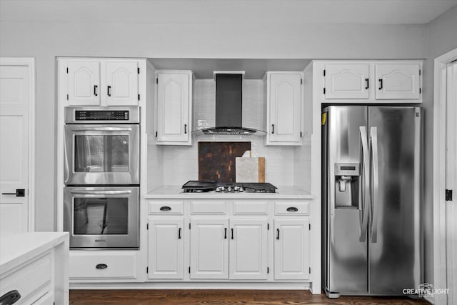 2255 University Dr, Naperville, IL 60565 - kitchen featuring appliances with stainless steel finishes, wall chimney exhaust hood, white cabinetry, and light countertops