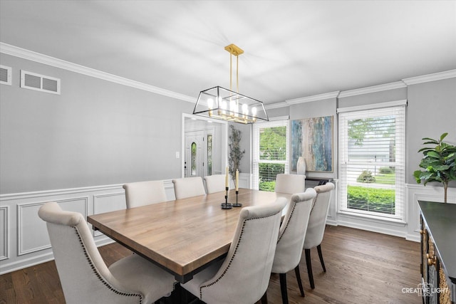 2255 University Dr, Naperville, IL 60565 - dining space with dark wood-type flooring, ornamental molding, a chandelier, a wainscoted wall, and a decorative wall