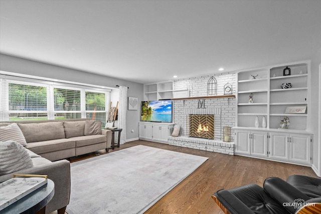 2255 University Dr, Naperville, IL 60565 - living area featuring dark wood-type flooring, a brick fireplace, recessed lighting, and built in shelves