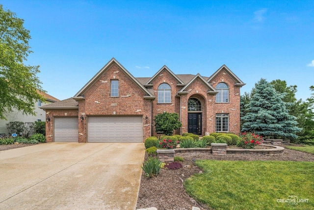25700 Pastoral Dr, Plainfield, IL 60585 - traditional-style home featuring concrete driveway, brick siding, a garage, and a front yard