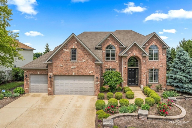 25700 Pastoral Dr, Plainfield, IL 60585 - traditional home featuring brick siding, concrete driveway, a shingled roof, and a garage