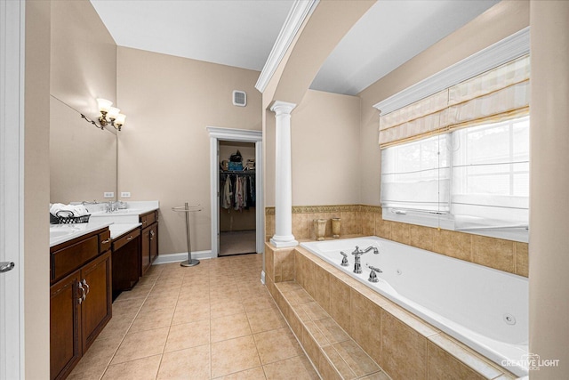 25700 Pastoral Dr, Plainfield, IL 60585 - bathroom with ornate columns, vanity, a jetted tub, a walk in closet, and tile patterned floors