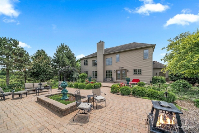25700 Pastoral Dr, Plainfield, IL 60585 - view of patio / terrace featuring french doors and an outdoor living space with a fire pit