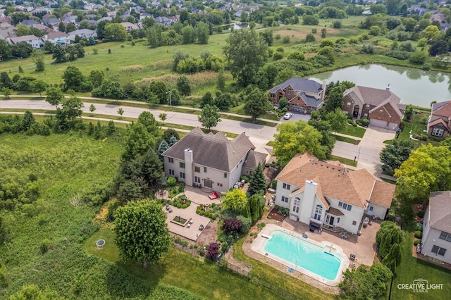 25700 Pastoral Dr, Plainfield, IL 60585 - aerial view of residential area with a nearby body of water and a pool area