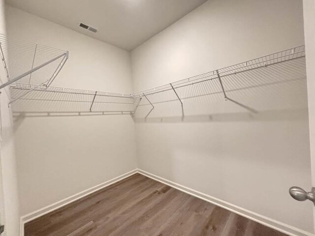 6900 Willow Dr, Wonder Lake, IL 60097 - spacious closet featuring dark wood-style flooring