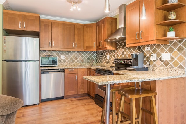 1033 Busse Hwy Unit 1D, Park Ridge, IL 60068 - kitchen featuring stainless steel appliances, wall chimney range hood, light stone counters, light wood-style floors, and open shelves