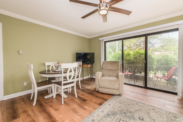1033 Busse Hwy Unit 1D, Park Ridge, IL 60068 - dining room featuring wood finished floors, ornamental molding, a ceiling fan, baseboards, and a baseboard heating unit