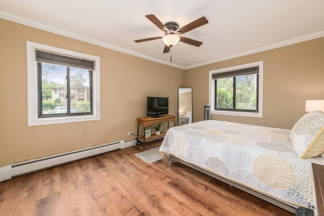 1033 Busse Hwy Unit 1D, Park Ridge, IL 60068 - bedroom featuring a baseboard heating unit, ornamental molding, wood finished floors, baseboards, and ceiling fan