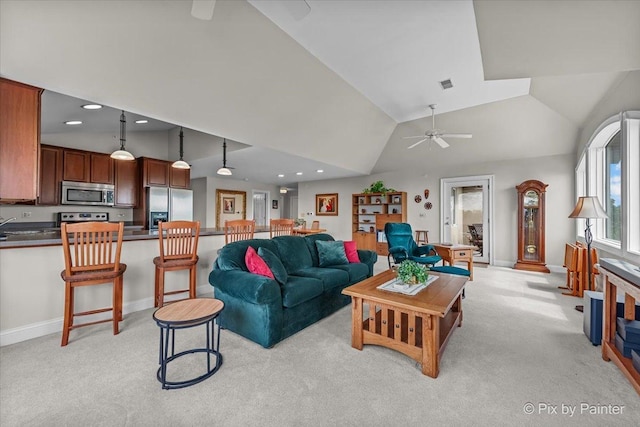 100 N River Ln Unit 409, Geneva, IL 60134 - living area with vaulted ceiling, light carpet, ceiling fan, recessed lighting, and baseboards