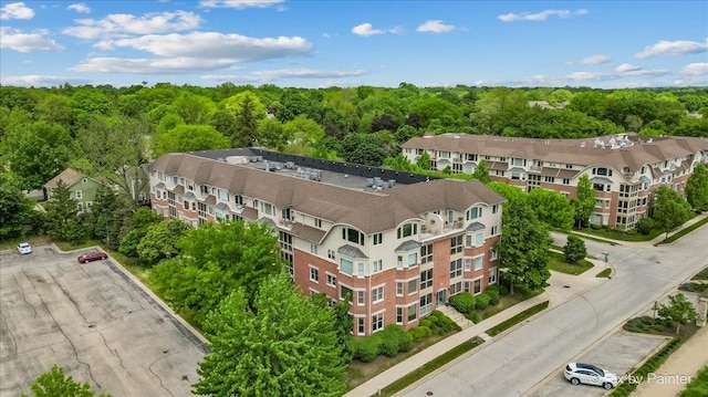 100 N River Ln Unit 409, Geneva, IL 60134 - drone / aerial view of apartment complex / building and a heavily wooded area