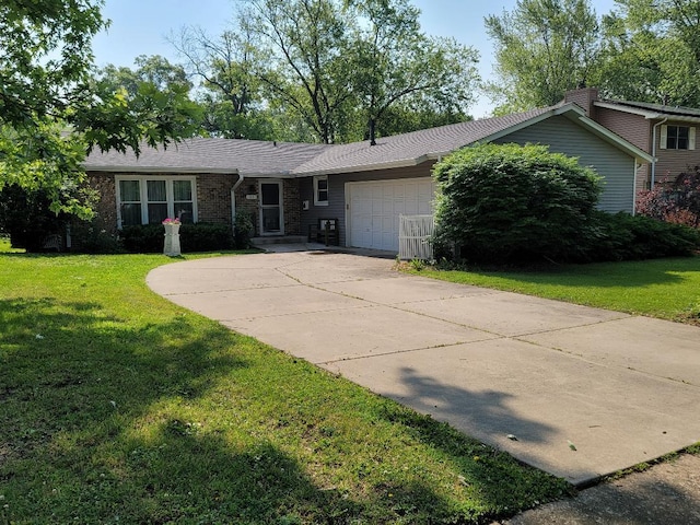 ranch-style home with an attached garage, a front lawn, and driveway