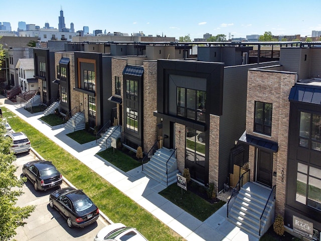 2049 W Race Ave, Chicago, IL 60612 - view of front of property featuring brick siding and a skyline view