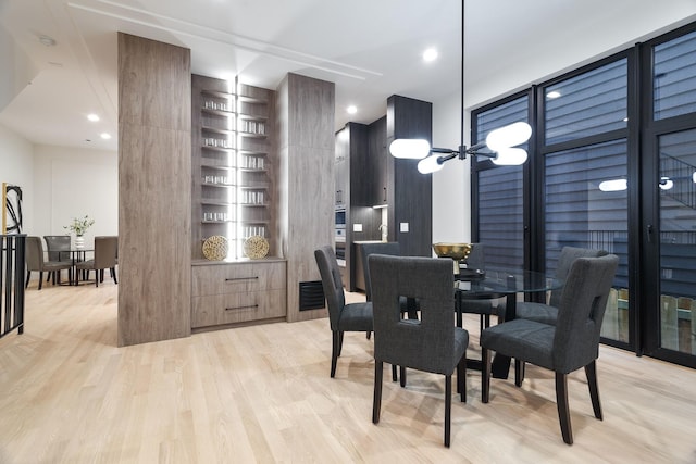 2049 W Race Ave, Chicago, IL 60612 - dining space with light wood-style flooring and built in shelves