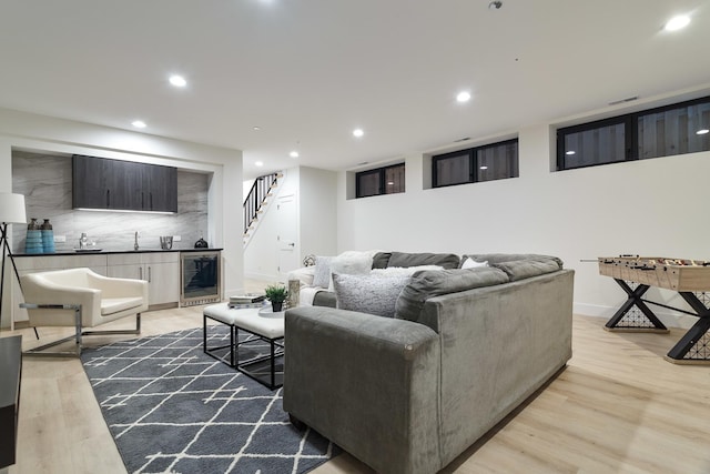 2049 W Race Ave, Chicago, IL 60612 - living area with beverage cooler, light wood-style floors, recessed lighting, stairs, and baseboards