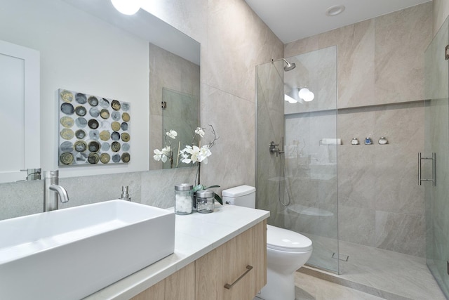 2049 W Race Ave, Chicago, IL 60612 - bathroom featuring a stall shower, toilet, vanity, and tile walls