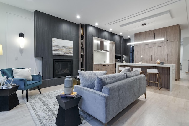 2049 W Race Ave, Chicago, IL 60612 - living room with light wood-style floors, a fireplace, and recessed lighting