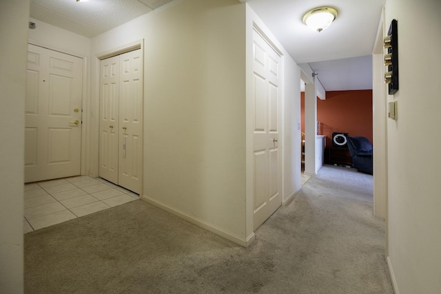 7021 W Touhy Ave Unit 305, Niles, IL 60714 - hall featuring carpet flooring, baseboards, and tile patterned floors