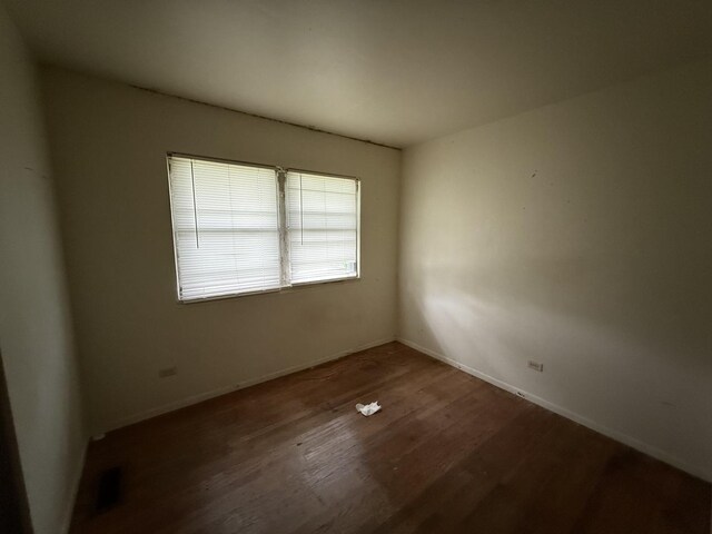 1869 Summit Ave, Kankakee, IL 60901 - empty room featuring wood finished floors and baseboards