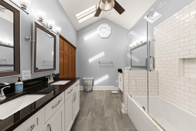 24202 W Commercial St, Plainfield, IL 60544 - bathroom with lofted ceiling, a skylight, a ceiling fan, double vanity, and combined bath / shower with glass door