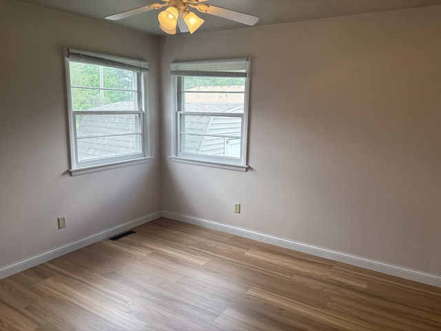 206 E Front St, Granville, IL 61326 - empty room featuring light wood finished floors, ceiling fan, and baseboards