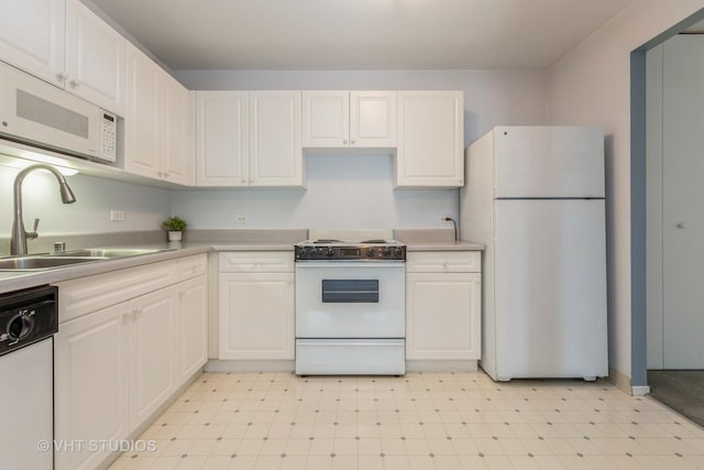 70 W Huron St Unit 1607, Chicago, IL 60654 - kitchen with white appliances, a sink, light floors, and white cabinets