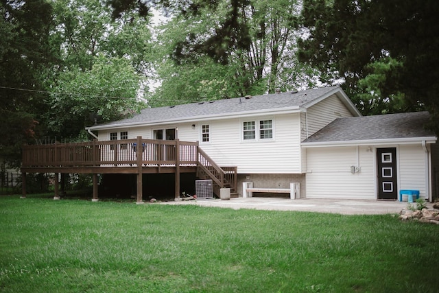 48 Norman St, Kankakee, IL 60901 - rear view of house featuring a wooden deck, a patio area, a lawn, a shingled roof, and central AC unit