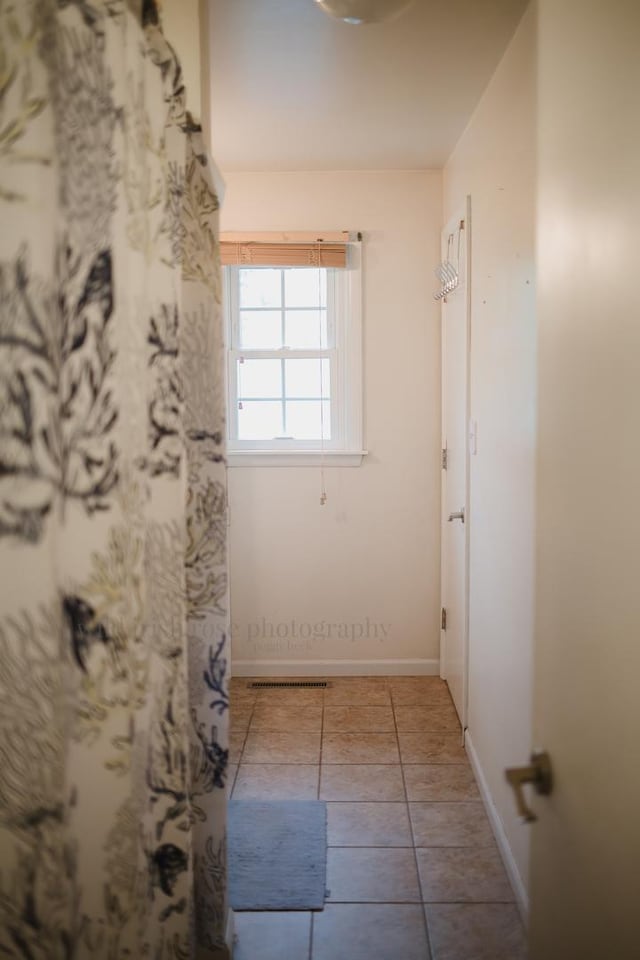 48 Norman St, Kankakee, IL 60901 - hallway with baseboards and tile patterned flooring