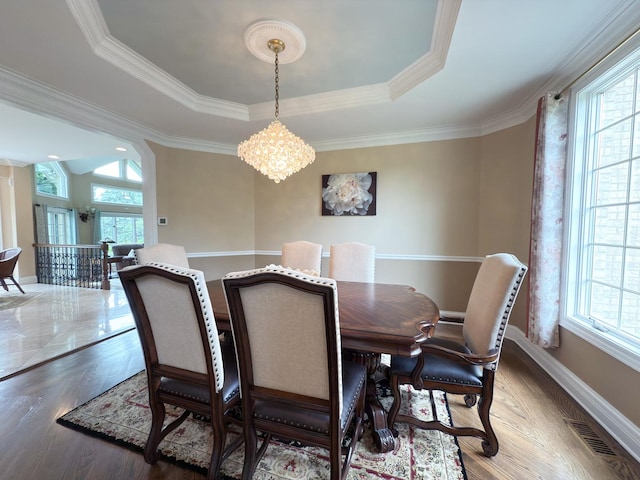 5 Todor Ct, Burr Ridge, IL 60527 - dining space featuring a chandelier, a tray ceiling, ornamental molding, baseboards, and wood finished floors