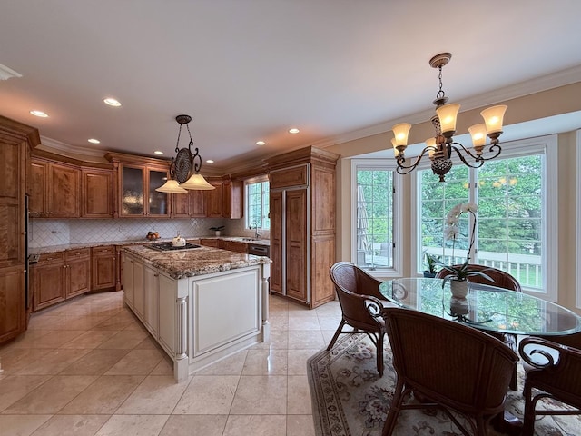 5 Todor Ct, Burr Ridge, IL 60527 - kitchen with stainless steel gas stovetop, brown cabinetry, a chandelier, ornamental molding, and decorative backsplash