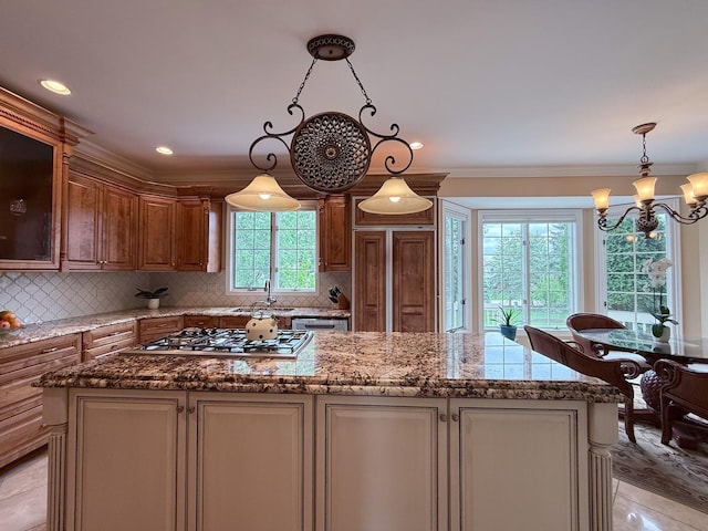 5 Todor Ct, Burr Ridge, IL 60527 - kitchen with appliances with stainless steel finishes, a chandelier, a center island, tasteful backsplash, and crown molding