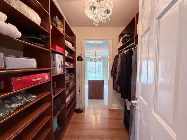 5 Todor Ct, Burr Ridge, IL 60527 - walk in closet featuring a chandelier and light wood finished floors