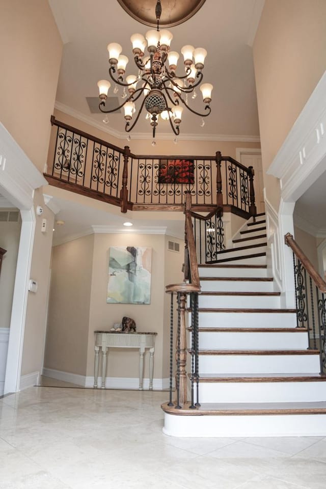 5 Todor Ct, Burr Ridge, IL 60527 - staircase with a chandelier, a high ceiling, baseboards, and ornamental molding