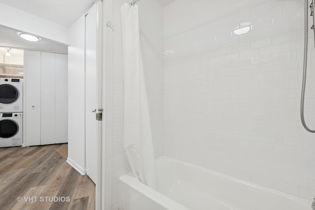 155 N Harbor Dr Unit 610, Chicago, IL 60601 - full bathroom featuring shower / tub combo with curtain, wood finished floors, and stacked washer / dryer