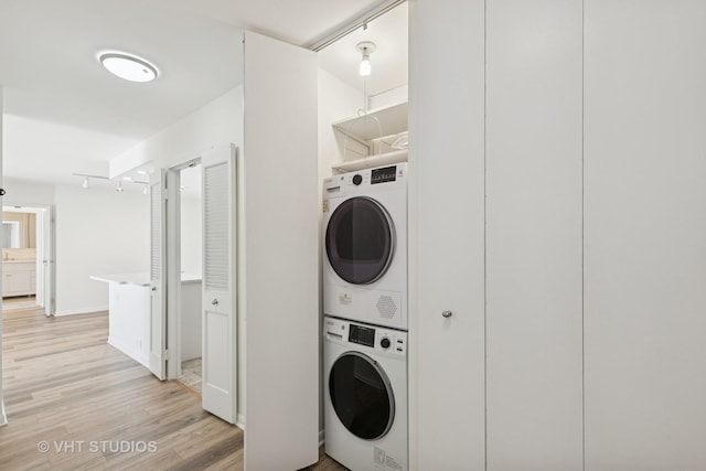 155 N Harbor Dr Unit 610, Chicago, IL 60601 - laundry room featuring stacked washer / dryer and light wood finished floors