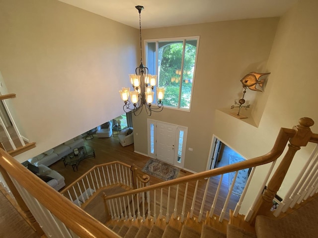 1312 Galloway Dr, Woodstock, IL 60098 - stairway featuring a chandelier and wood finished floors