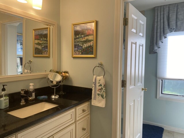 1312 Galloway Dr, Woodstock, IL 60098 - bathroom with vanity and baseboards
