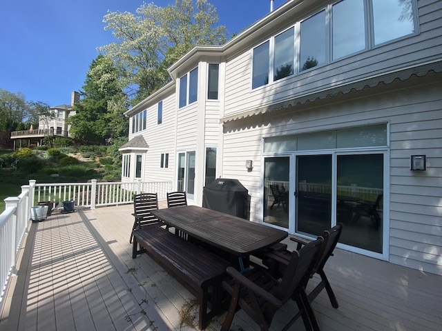 1312 Galloway Dr, Woodstock, IL 60098 - wooden terrace with grilling area and outdoor dining space