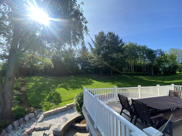 1312 Galloway Dr, Woodstock, IL 60098 - view of grassy yard with outdoor dining area and a deck