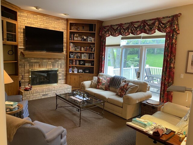 1312 Galloway Dr, Woodstock, IL 60098 - living area featuring built in shelves and a brick fireplace