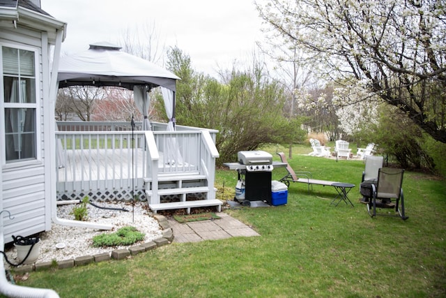 view of grassy yard with a gazebo and a deck