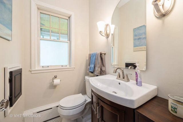944 Fair Oaks Ave, Oak Park, IL 60302 - half bathroom featuring a baseboard heating unit and vanity