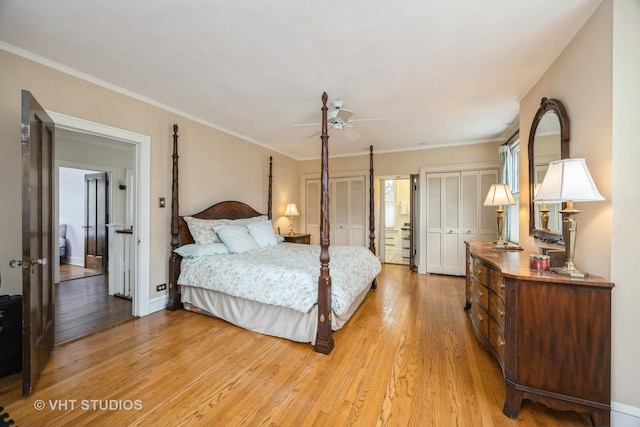 944 Fair Oaks Ave, Oak Park, IL 60302 - bedroom with multiple closets, light wood-style flooring, ornamental molding, and a ceiling fan