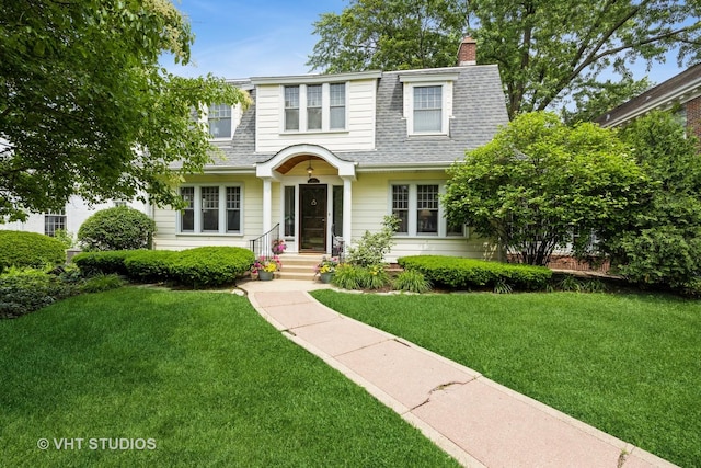 944 Fair Oaks Ave, Oak Park, IL 60302 - view of front of home featuring a shingled roof, a front lawn, and a chimney