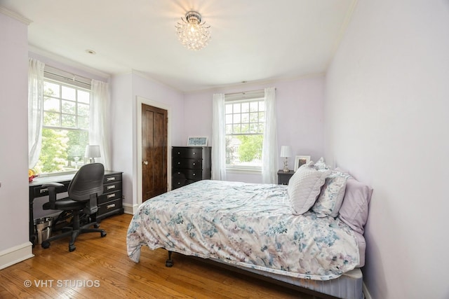 944 Fair Oaks Ave, Oak Park, IL 60302 - bedroom featuring wood finished floors, an office area, and crown molding