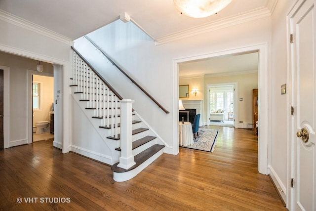 944 Fair Oaks Ave, Oak Park, IL 60302 - foyer featuring crown molding, wood finished floors, stairway, and a fireplace