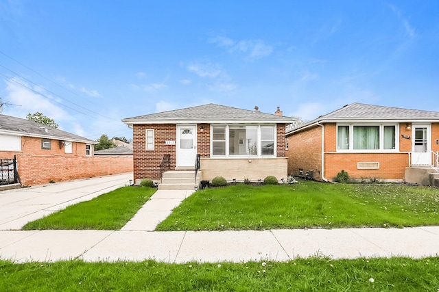 bungalow-style house with brick siding and roof with shingles
