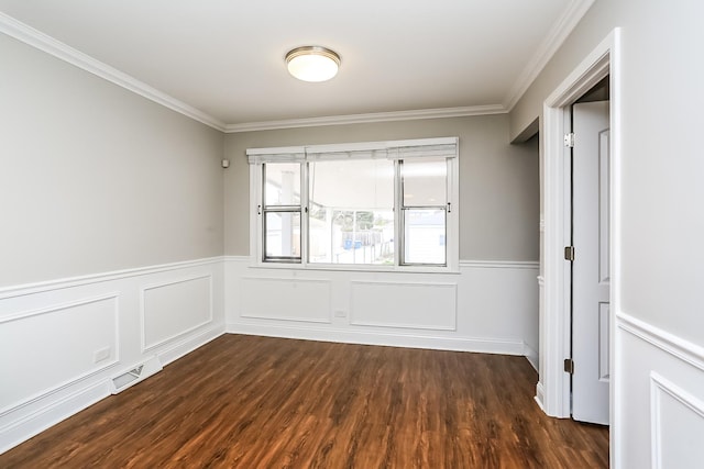 unfurnished bedroom with ornamental molding, dark wood finished floors, and a wainscoted wall